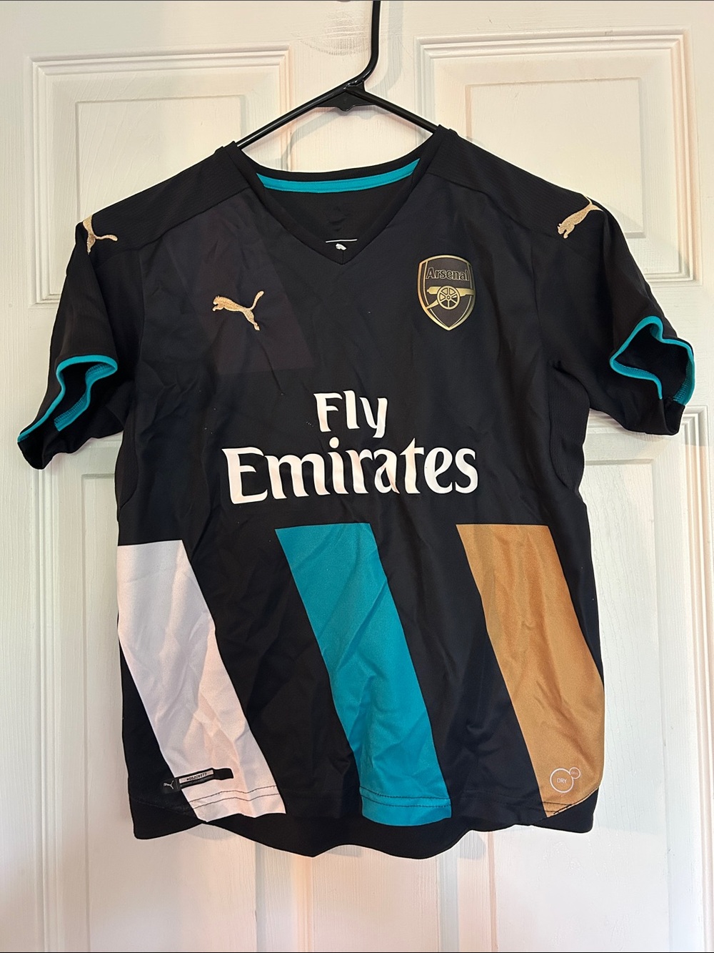 Puma Black Arsenal Kids' Fly Emirates Football Jersey with Teal & Gold Accents